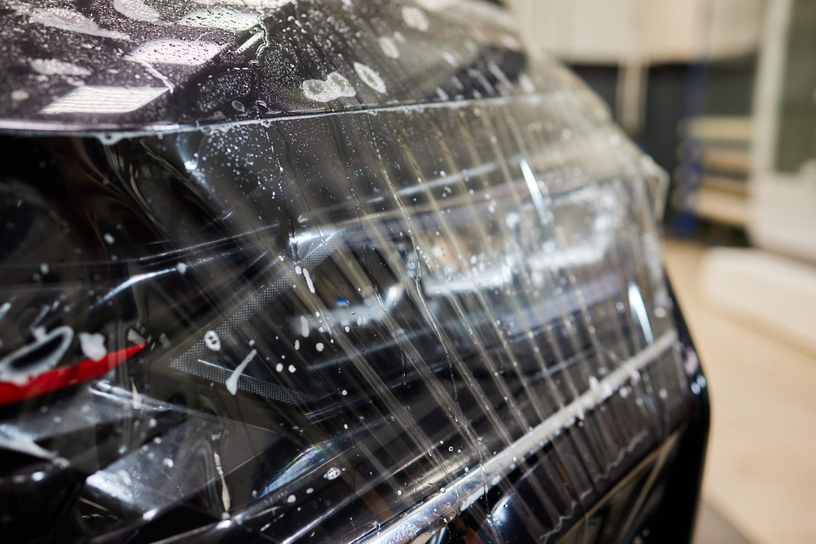 Protection of hood and front of the car with a colorless protective film.